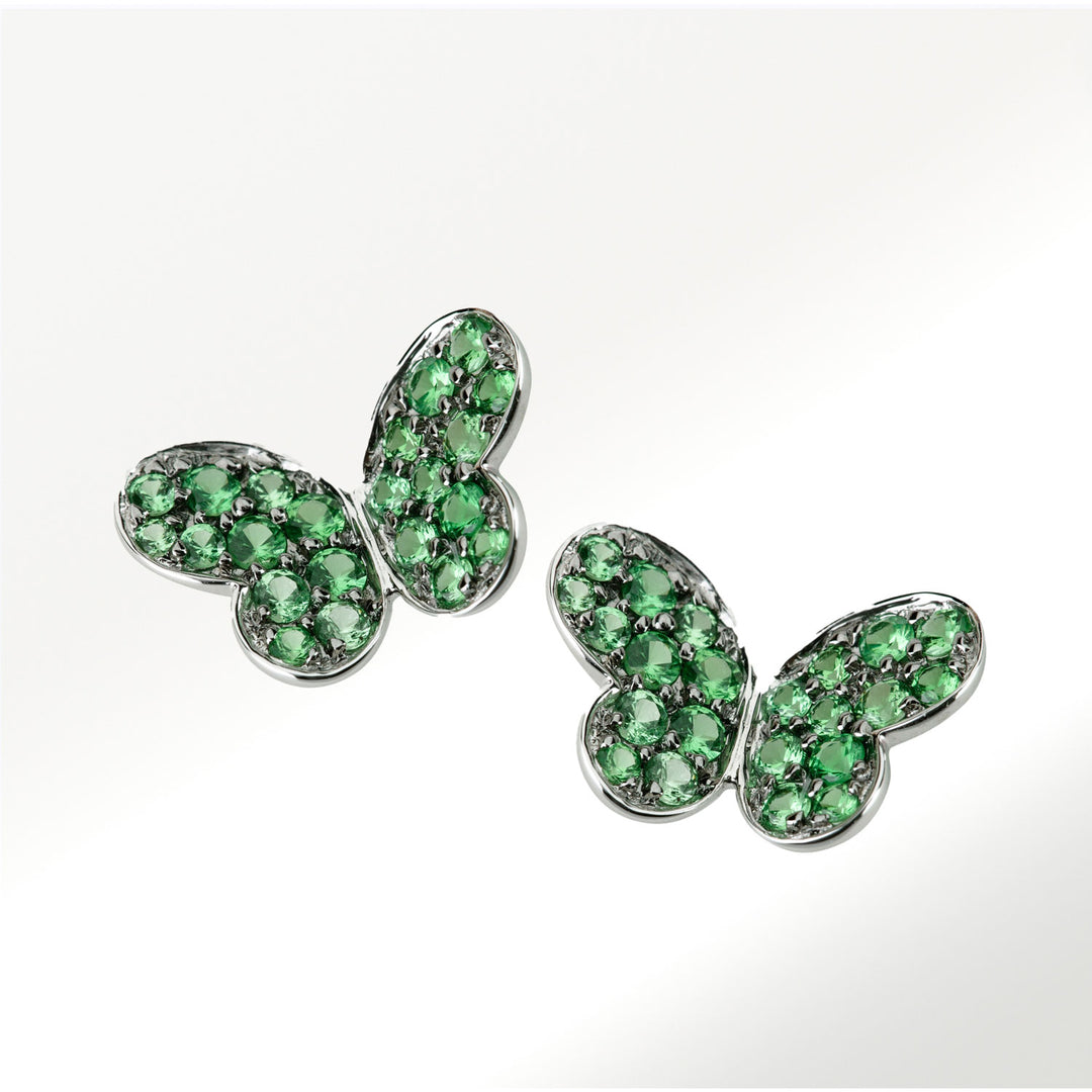 Pendientes medianos de la colección Mariposas de oro blanco de 18 quilates y tsavoritas de 0’53 quilates by Elena Carrera